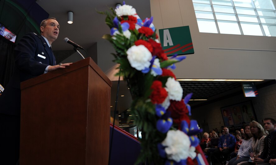 Col. Brian Newberry speaks to a crowd of hundreds during the Veterans Day celebration at the Spokane Arena in Spokane, Wash., Nov. 11, 2012. Several speakers shared their experiences and representatives of elected officials sent letters voicing their support for veterans of the Inland Northwest. Newberry is the commander of the 92nd Air Refueling Wing. (U.S. Air Force photo by Staff Sgt. J.G. Buzanowski)