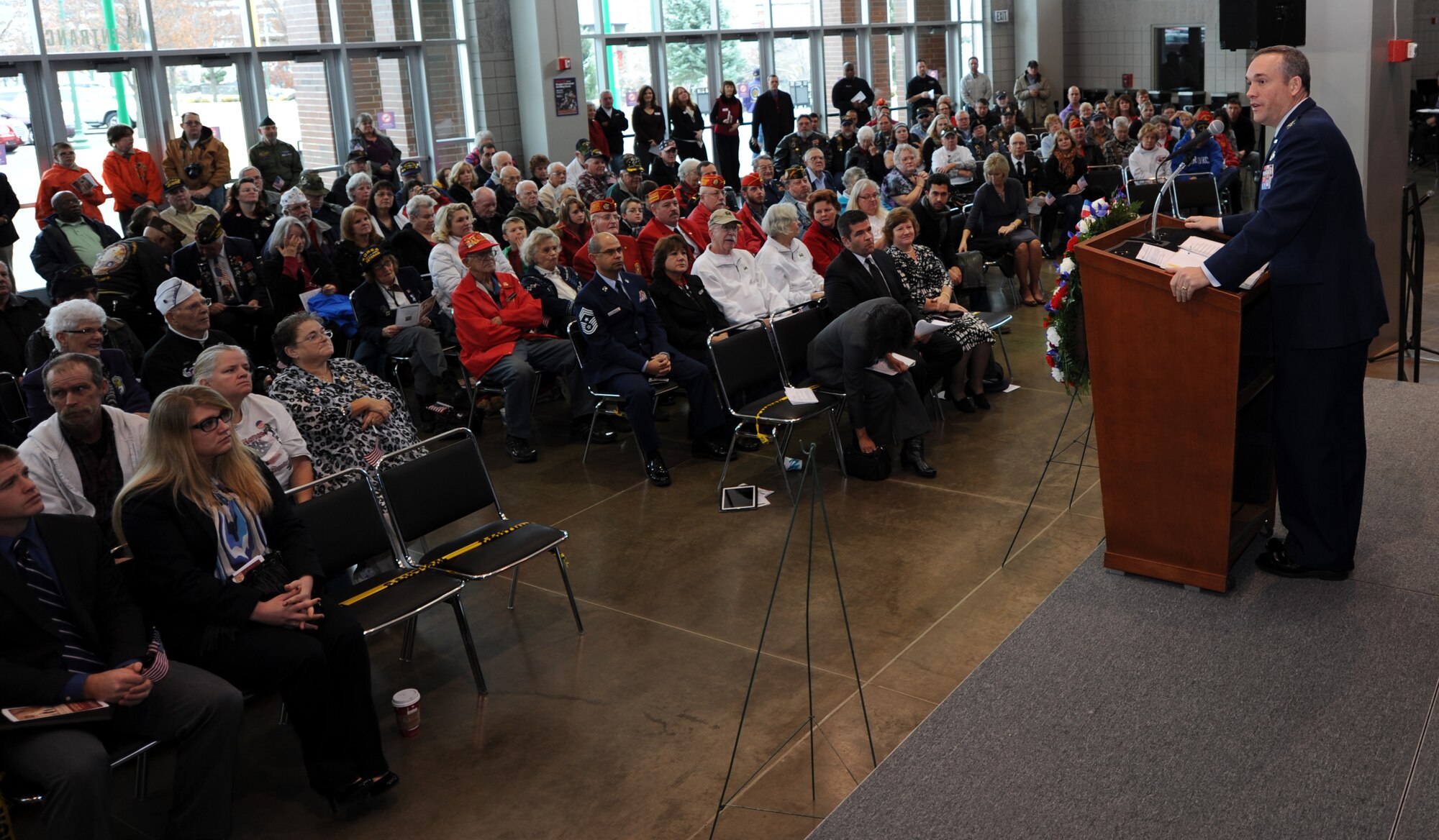 Col. Brian Newberry speaks to a crowd of hundreds during the Veterans Day celebration at the Spokane Arena in Spokane, Wash., Nov. 11, 2012. Several speakers shared their experiences and representatives of elected officials sent letters voicing their support for veterans of the Inland Northwest. Newberry is the commander of the 92nd Air Refueling Wing. (U.S. Air Force photo by Staff Sgt. J.G. Buzanowski)