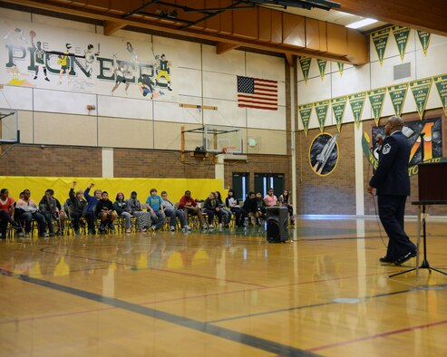 Master Sgt. Daryl Hogan Jr., 10th Airlift Squadron first sergeant, answers questions asked by students at Meeker Middle School during a Veterans Day assembly Nov. 9, 2012, in Renton, Wash. Hogan spoke about the importance of Veterans Day and the sacrifices that service members make. (U.S. Air Force photo/Staff Sgt. Frances Kriss)