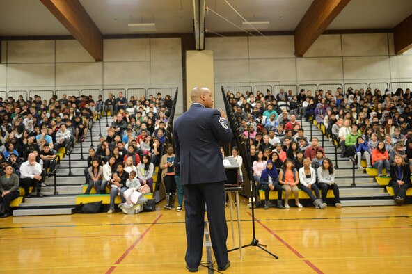 Master Sgt. Daryl Hogan Jr., 10th Airlift Squadron first sergeant, speaks to more than 600 students and faculty members at Meeker Middle School during a Veterans Day assembly Nov. 9, 2012 in Renton, Wash. Hogan spoke about the importance of Veterans Day. (U.S. Air Force photo/Staff Sgt. Frances Kriss)