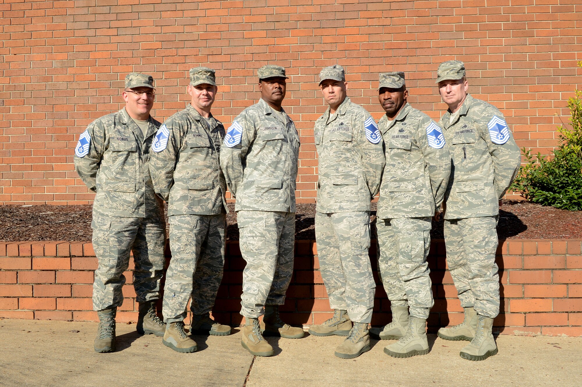 U.S. Air Force chief master sergeant selects pose for a group photo at the Carolina Skies Club and Conference Center, Shaw Air Force Base, S.C., Oct. 8, 2012.  (U.S. Air Force photo by Airman Nicole Sikorski/Released)