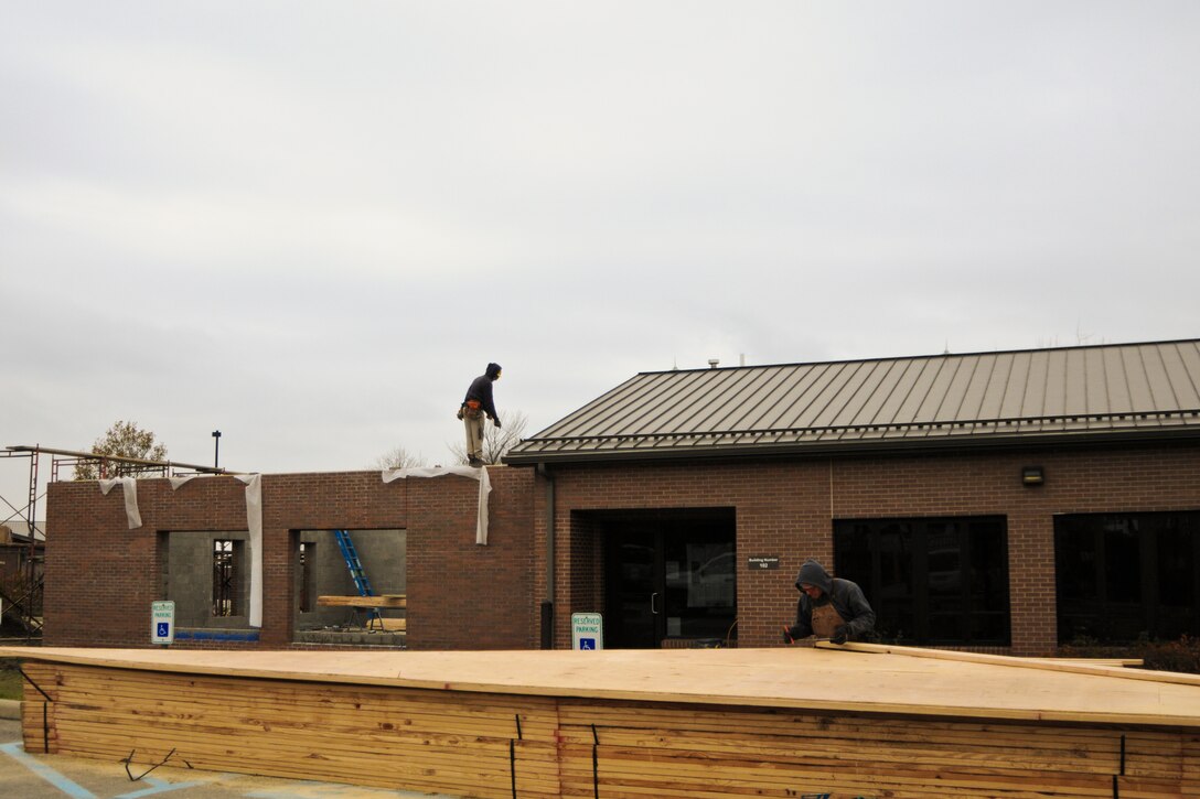 YOUNGSTOWN AIR RESERVE STATION, Ohio — Mr. Mark Hannan, senior carpenter, cuts the gable end of the roof of the visitor center here, Nov. 13, 2012. Hannan and the other contractors are prepping the roof area for the trusses that will be hoisted into place by a crane tomorrow.  Released/U.S. Air Force photo by Tech. Sgt. Brenda Cosola