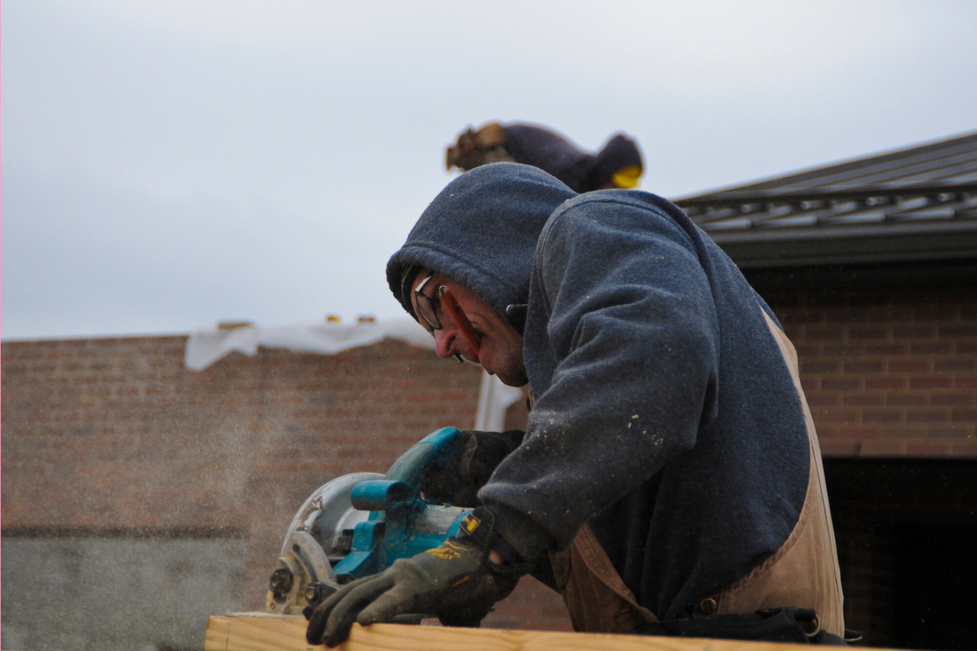YOUNGSTOWN AIR RESERVE STATION, Ohio — Mr. Mark Hannan, senior carpenter, cuts the gable end of the roof of the visitor center here, Nov. 13, 2012. Hannan and the other contractors are prepping the roof area for the trusses that will be hoisted into place by a crane tomorrow. Released/U.S. Air Force photo by Tech. Sgt. Brenda Cosola