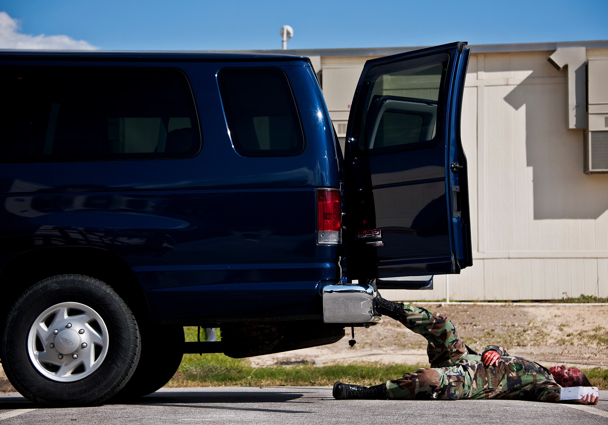 A simulated victim is thrown from a van after an explosion that begins the 96th Medical Group’s radiological response exercise Nov. 7 at Eglin Air Force Base, Fla.  The goal of the exercise was to evaluate the base’s response to a terrorist bombing and the group’s reaction to a chemical, biological, radiological, nuclear and explosive (CBRNE) incident.  (U.S. Air Force photo/Samuel King Jr.)
