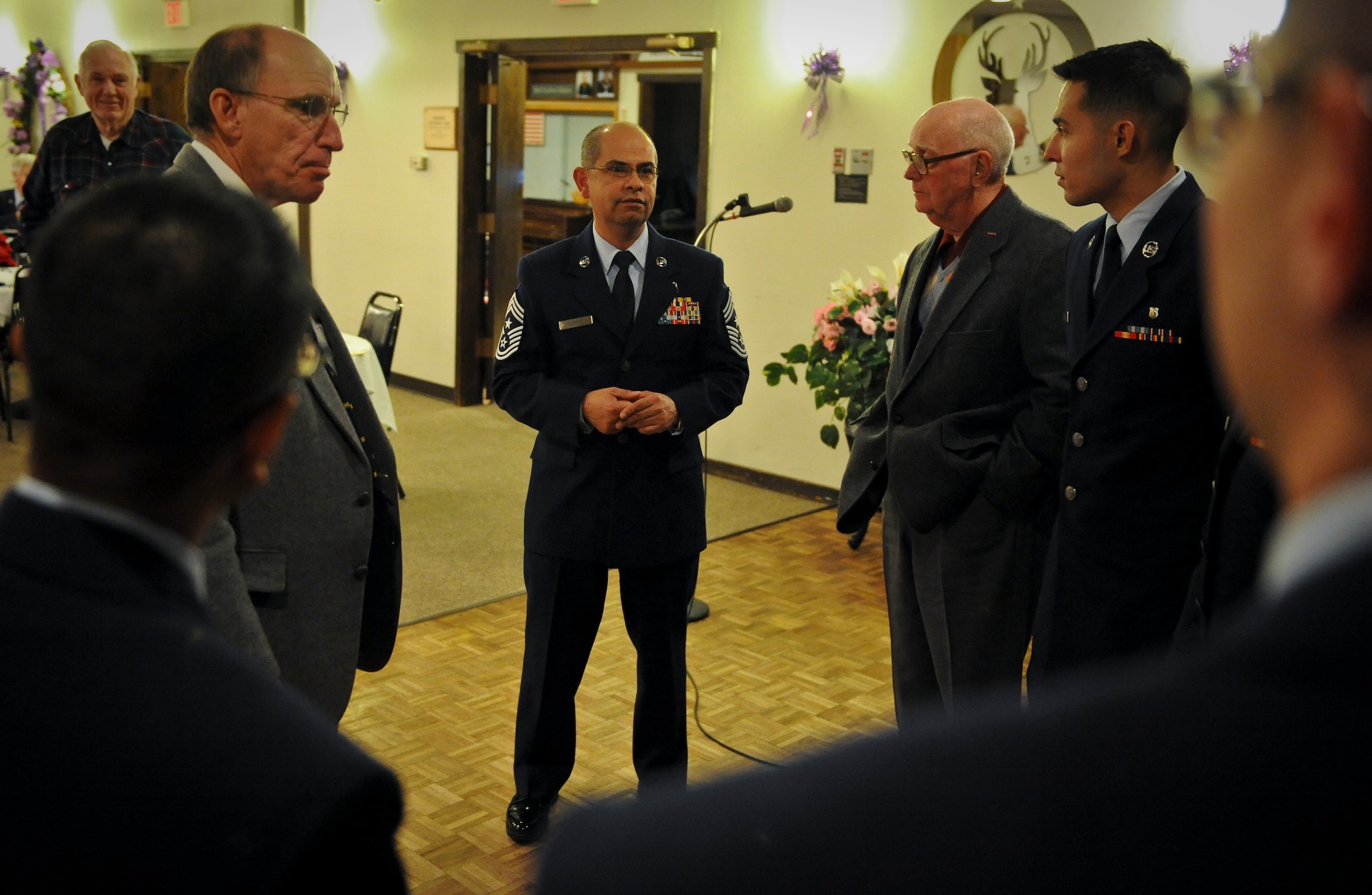 Chief Master Sgt. Rudy Lopez talks with Fairchild Airmen and veterans at the Elks Lodge in Spokane Valley, Wash., Nov. 10, 2012. Fairchild Airmen visited with veterans of past and present throughout the weekend. Lopez is the 92nd Air Refueling Wing command chief. (U.S. Air Force photo by Senior Airman Benjamin Stratton)