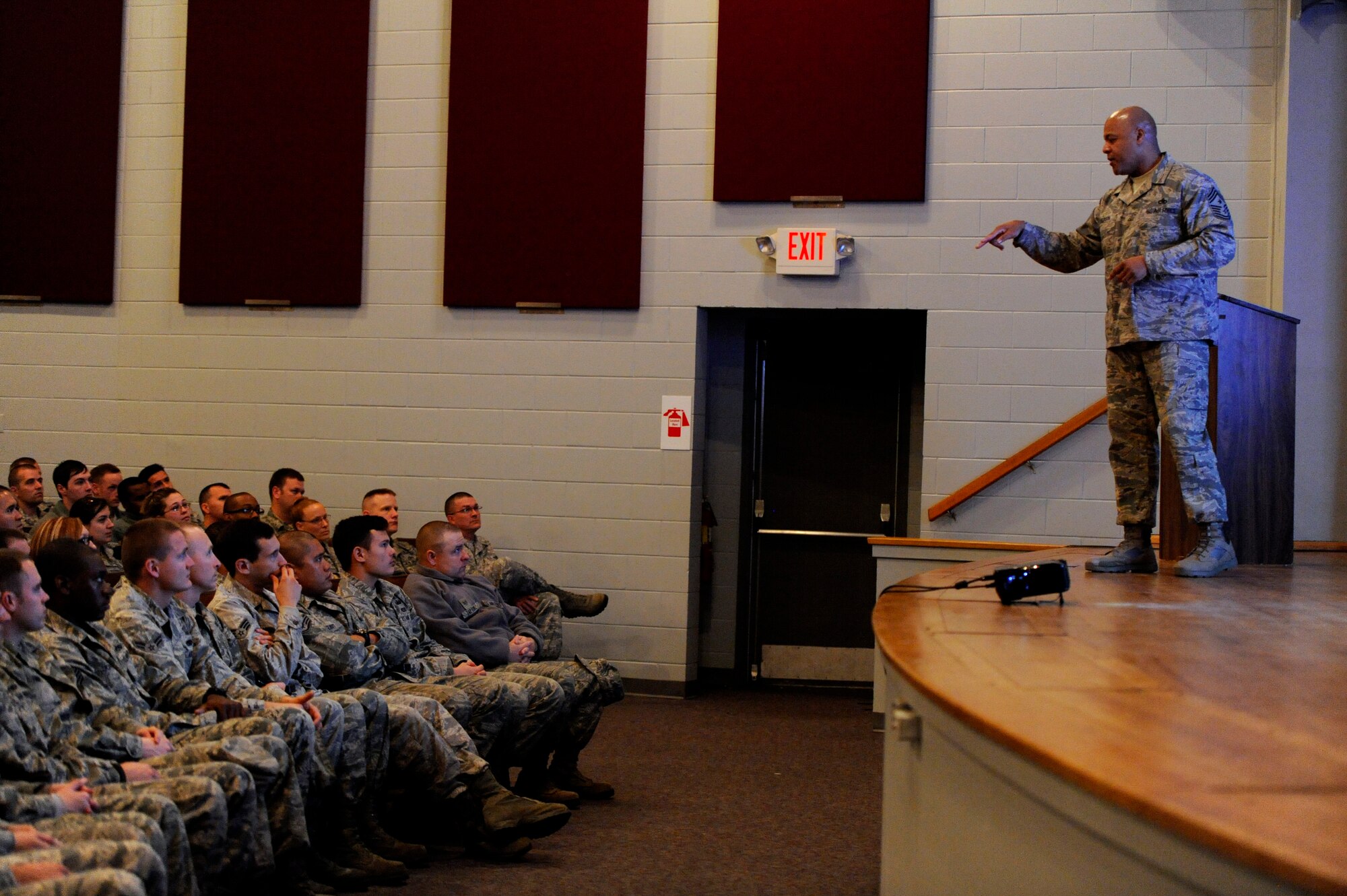 U.S. Air Force Chief Master Sgt. James Wilkerson, 20th Fighter Wing command chief, speaks to Team Shaw Airmen during an enlisted all call, Nov. 9, 2012, Shaw Air Force Base, S.C. Wilkerson conducted two separate all calls during the day to optimize attendance as he conveyed the senior enlisted perspective of the 20th FW Commander’s message and intent. Wilkerson kept Airmen engaged as he shared a few stories and directly answered questions from those in attendance. (U.S. Air Force photo by Staff Sgt. Kenny Holston/Released) 