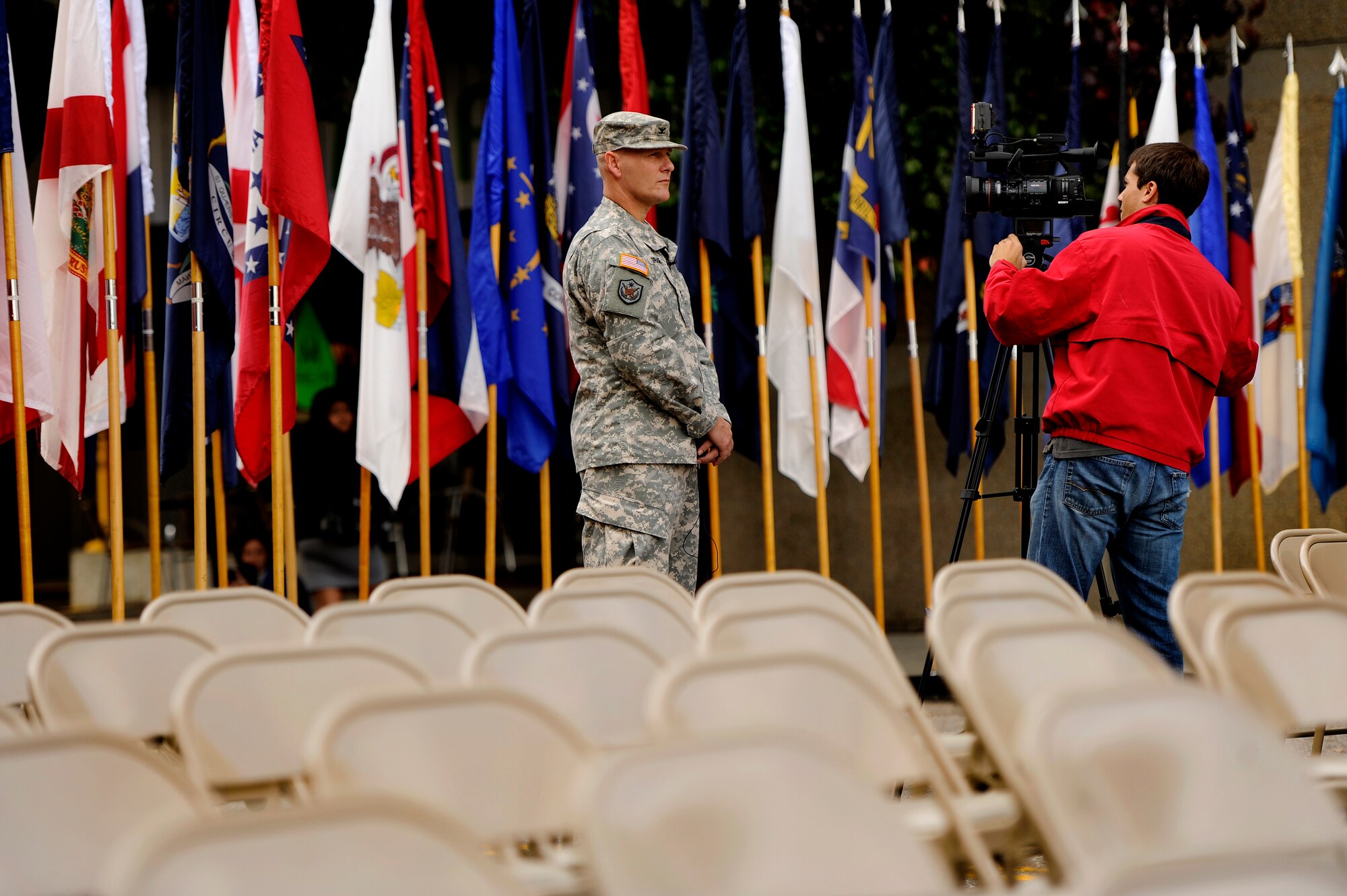 A U.S. Army Col. does an interview for a local television station during a Veterans Day Parade, Nov. 12, 2012, Columbia, S.C. The parade, which took place on Sumter Street in the middle of downtown, saw hundreds of civilians, veterans, and active-duty military personnel, to include Airmen from Shaw Air Force Base, in attendance. The event was Columbia’s 34th annual Veterans Day Parade. (U.S. Air Force photo by Staff Sgt. Kenny Holston/Released) 