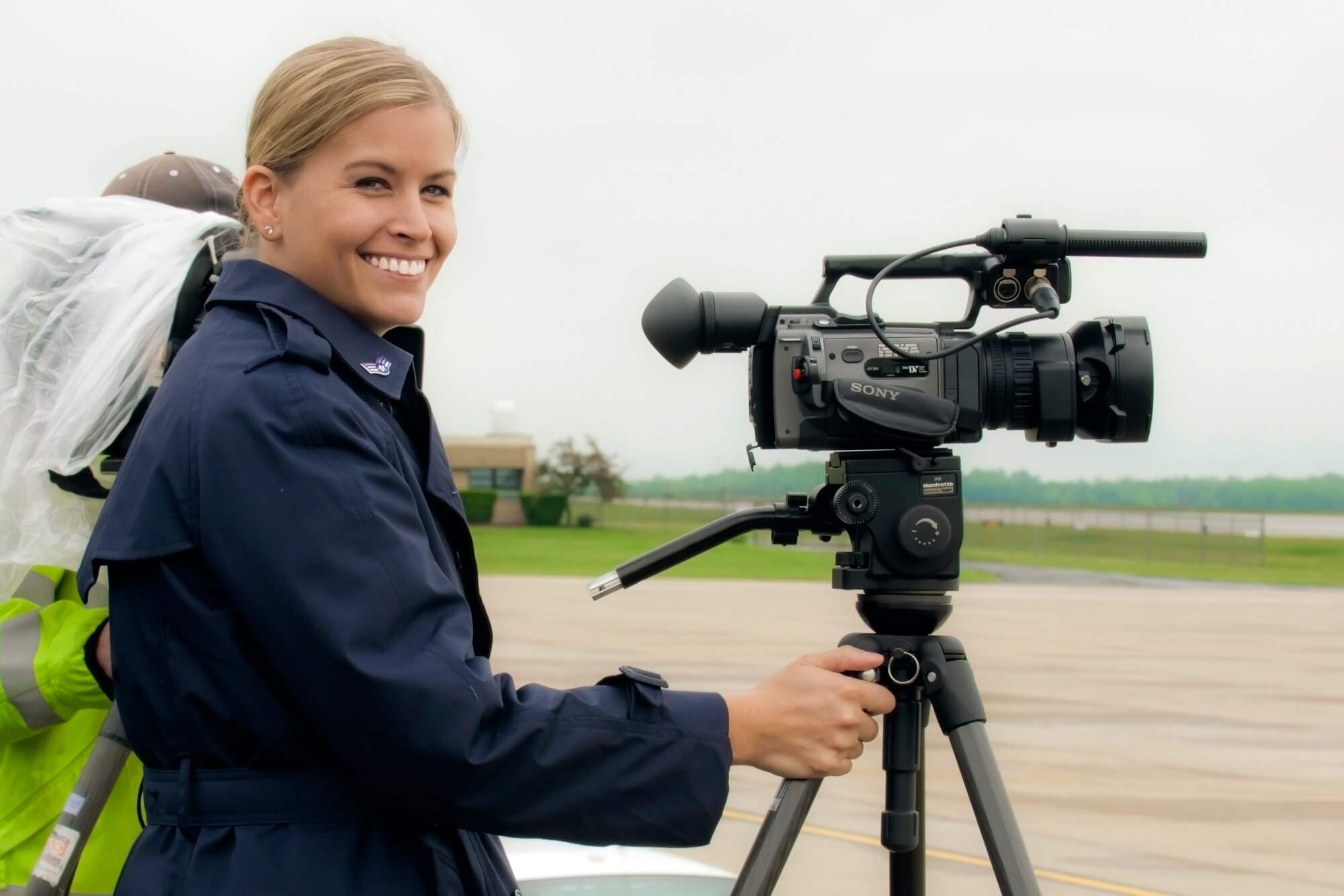 YOUNGSTOWN AIR RESERVE STATION, Ohio -- U.S. Air Force Reserve Senior Airman Valerie Smock, public affairs specialist with the 910th Airlift Wing here, awaits the arrival of President Barack Obama May 18, 2010 on the flightline here. Smock, now a technical sergeant, participates yearly in the Susan G. Komen 3-Day for a Cure, a 60-mile walk to help raise awareness and find a cure for breast cancer. Released/U.S. Air Force photo by Tech. Sgt. Brenda Cosola  
