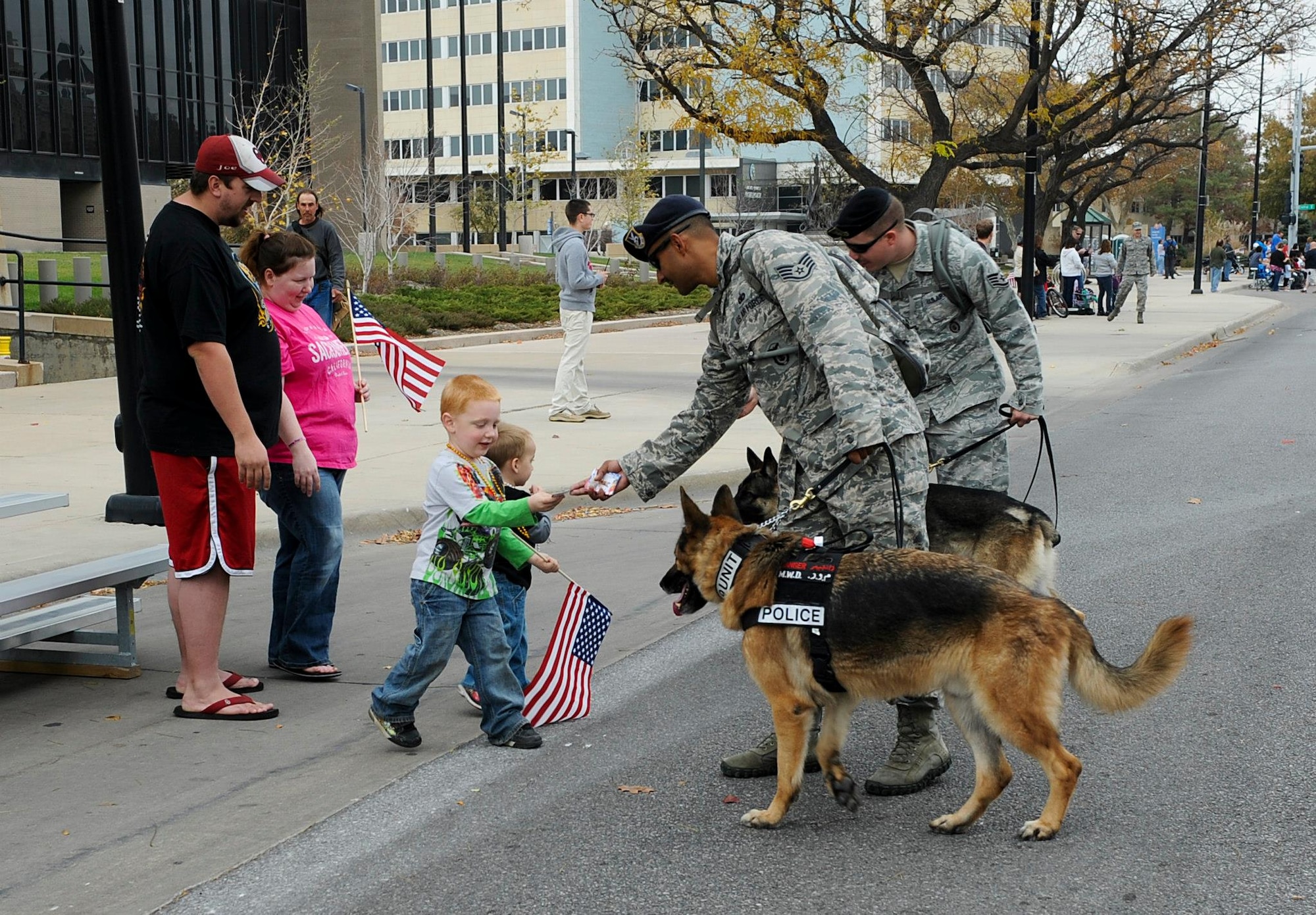Members of Hearts Apart ride in McConnell’s float during the 2012 Wichita Veterans Day Parade Nov. 10 2012, Wichita Kan. Hearts Apart is a program designed for spouses, children and families of military members who are currently deployed or on an extended tour of duty. Parade participation is one of the many ways in which the program helps families stay involved and connected to the base community. (U.S. Air Force photo/2nd Lt. Jessica Brown)