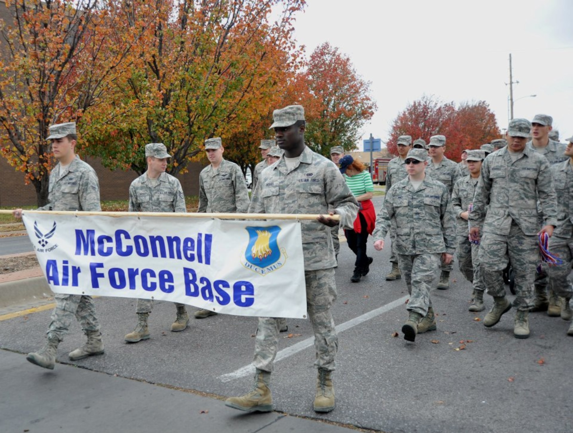 Team McConnell members march in the 2012 Wichita Veterans Day parade Nov. 10, 2012, in Wichita, Kan. Several hundred people gathered along Wichita’s Main Street to show their support for veterans and active duty service members. (U.S. Air Force photo/Staff Sgt. Abigail Klein)