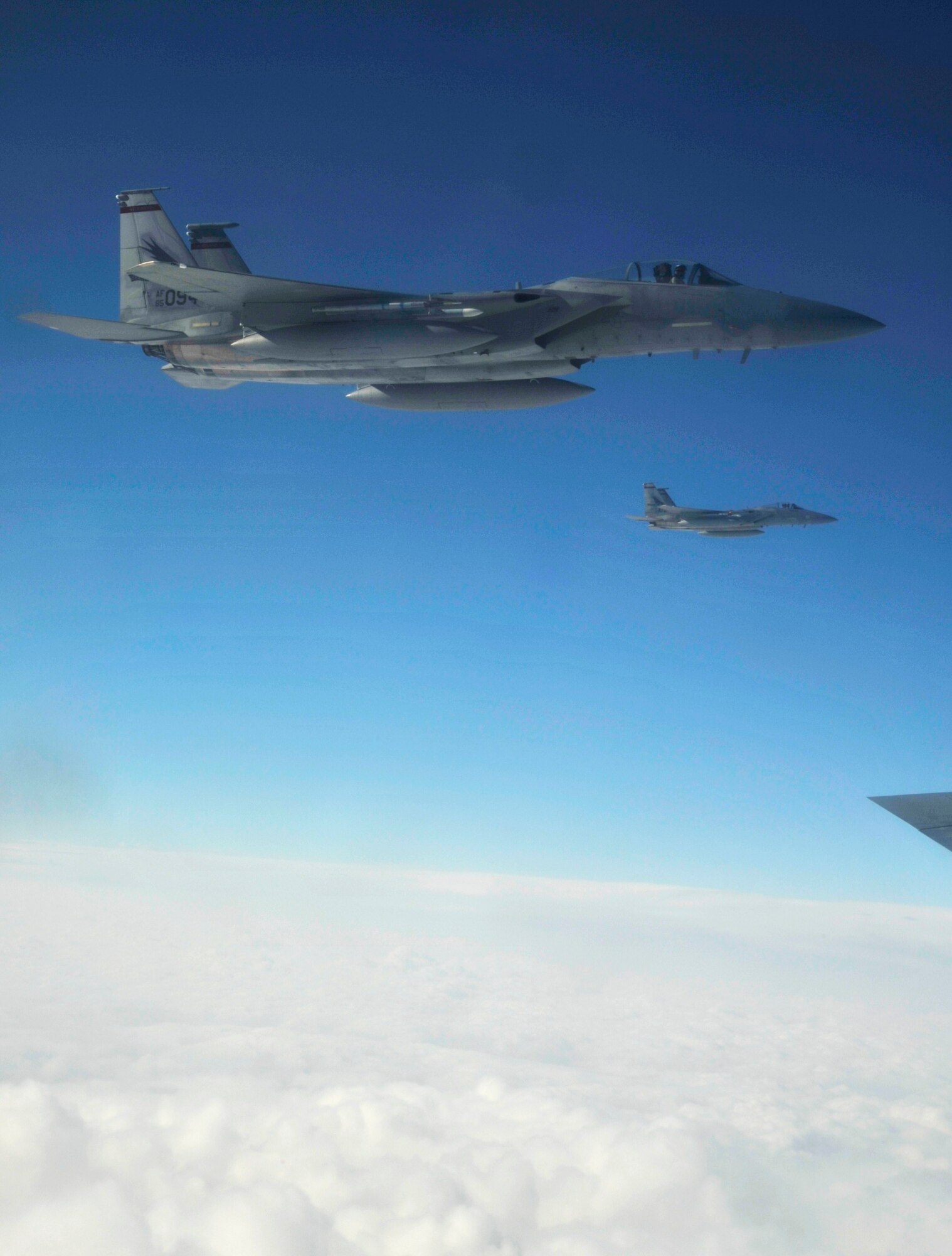 Two F-15 Eagles from the 173rd Fighter Wing at Kingsley Field Air National Guard Base in Oregon, fly next to a KC-135 Stratotanker during a refueling training mission Nov. 15, 2012. This training mission was an opportunity for the surrounding Fairchild community to experience the mission first hand. (U.S. Air Force photo by Senior Airman Mary O'Dell)