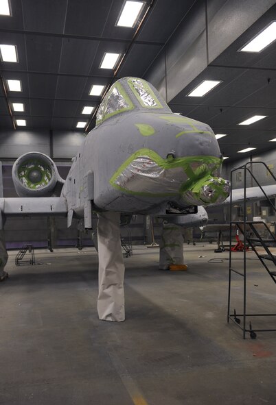 An A-10C Thunderbolt II sits in the fabrication flight hangar at Moody Air Force Base, Ga., Nov. 7, 2012. The 23d Equipment Maintenance Squadron fabrication flight restores the paint on A-10s and HH-60G Pave Hawk helicopters due to the wear it receives while conducting missions at home station and downrange. (U.S. Air Force photo by Airman 1st Class Olivia Bumpers/Released)