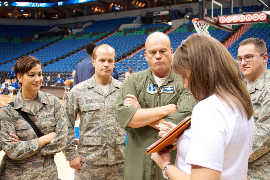 MINNEAPOLIS, Minn. -Airmen from the 133rd Airlift Wing prepare to present a giant flag for the National Anthem during the Minn. TImberwolves' Military Appreciation Night Nov. 9 at the Target Center. (U.S. Aif Force photo by Staff Sgt. Jonathan Young.)