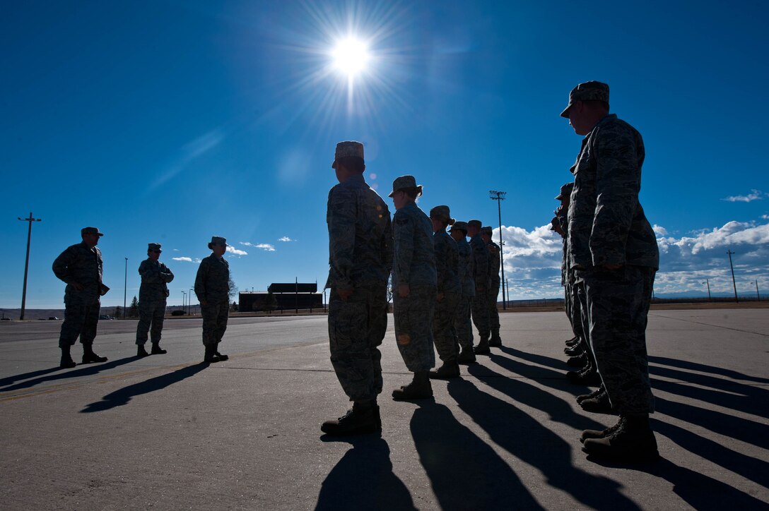 Airmen prepare for drill and marching exercises during Airman Leadership School at Ellsworth Air Force Base, S.D., Nov. 2, 2012. ALS is an Air Force education program designed to prepare Airmen for positions of greater responsibility by providing them with a variety of leadership skills required of supervisors and reporting officials throughout the Air Force. (U.S. Air Force photo by Airman 1st Class Zachary Hada/Released)