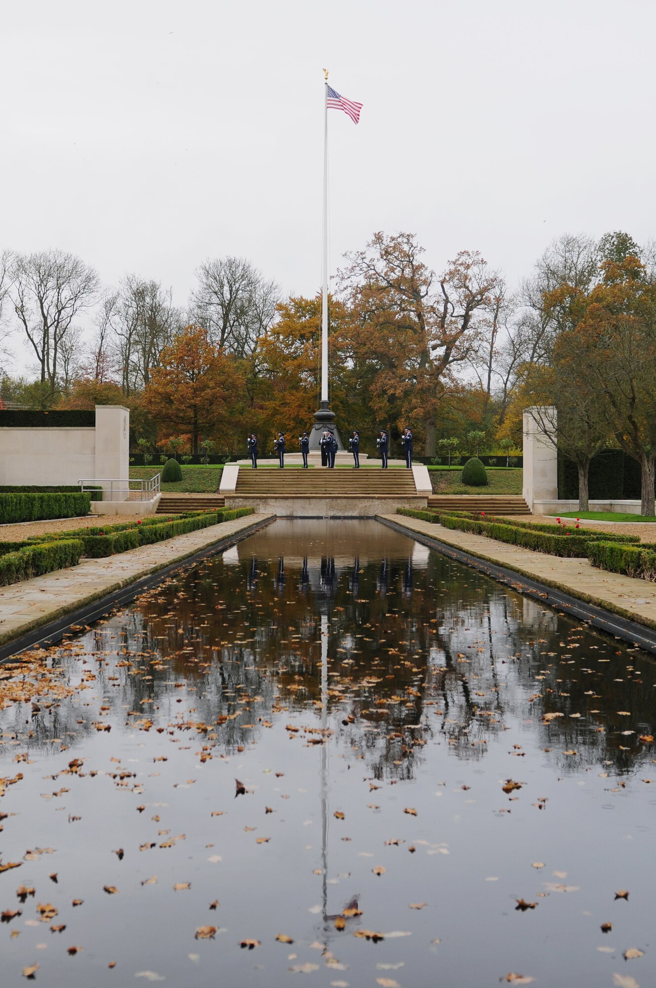 CAMBRIDGE, England – Members of the RAF Alconbury Honor Guard perform a twenty-one gun salute at the Madingley American Cemetery during a Veterans Day memorial service Nov. 12, 2012. The ceremony was hosted by the 501st Combat Support Wing, RAF Alconbury, to honor and remember those who gave their lives in wars in Europe.  (U.S. Air Force photo by Airman 1st Class Cory D. Payne)
