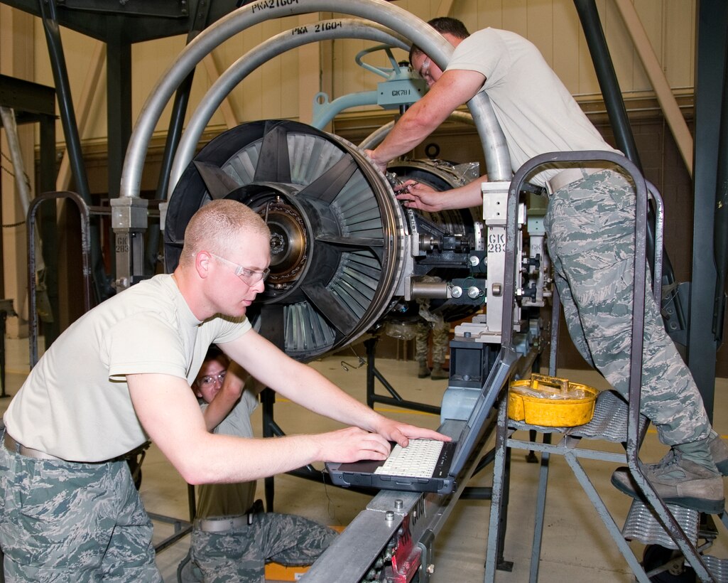 Airman Brandon Janshen, Airman Dylan Guevara and Senior Airman Wyatt Paschal, 361 Training Squadron, practice the removal of a heat shield from an engine of a F-15 aircraft Aug. 03, 2012 at Sheppard Air Force Base, Texas.  Aerospace propulsion training is broken down into four apprentice courses.  (US Air Force Photo by Frank Carter)