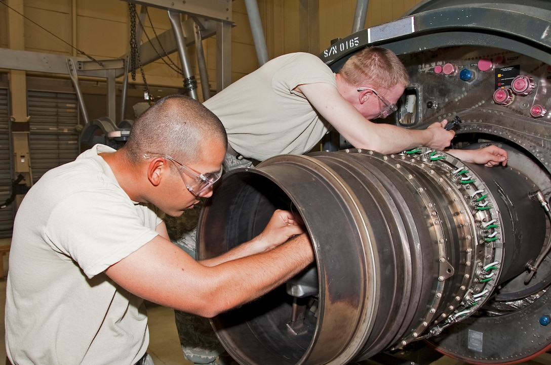 Airman 1st Class Dabnell Morales-Sanchez and Airman Blake Wooten,361st Training Squadron, train to install a turbine exhaust case on a T-56 turbo prop Aug. 03, 2012 at Sheppard Air Force Base, Texas.  The T-56 engines are used to train turboprop  basic mechanics.  (US Air Force Photo by Frank Carter)