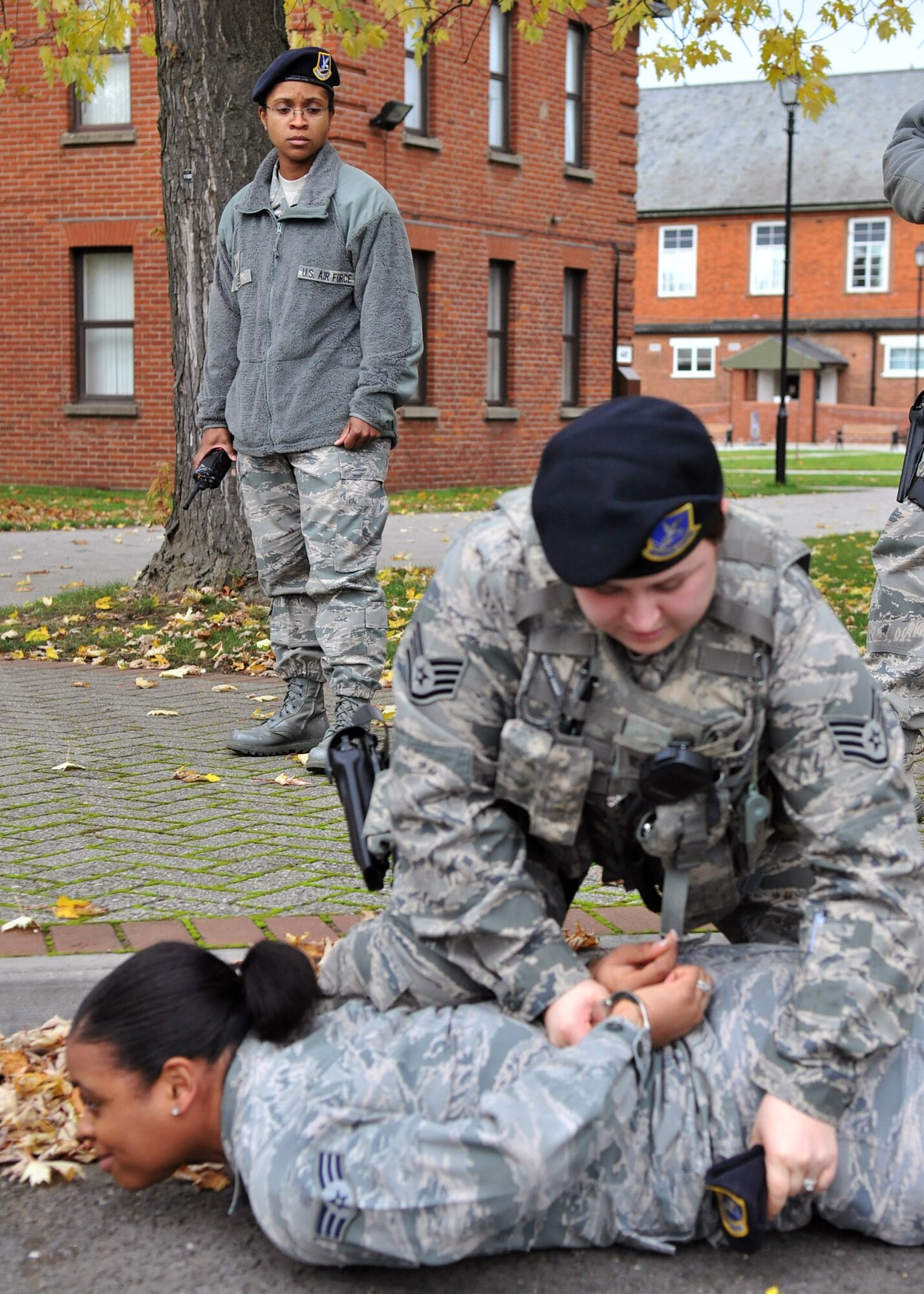 Tech. Sgt. Ashley Tyler, 100th Security Forces Squadron standardization and evaluation team member, oversees an exercise Nov. 9, 2012, at RAF Mildenhall, England. As an evaluator, Tyler assesses squadron personnel to ensure job proficiency. (U.S. Air Force photo by Senior Airman Jerilyn Quintanilla/Released)