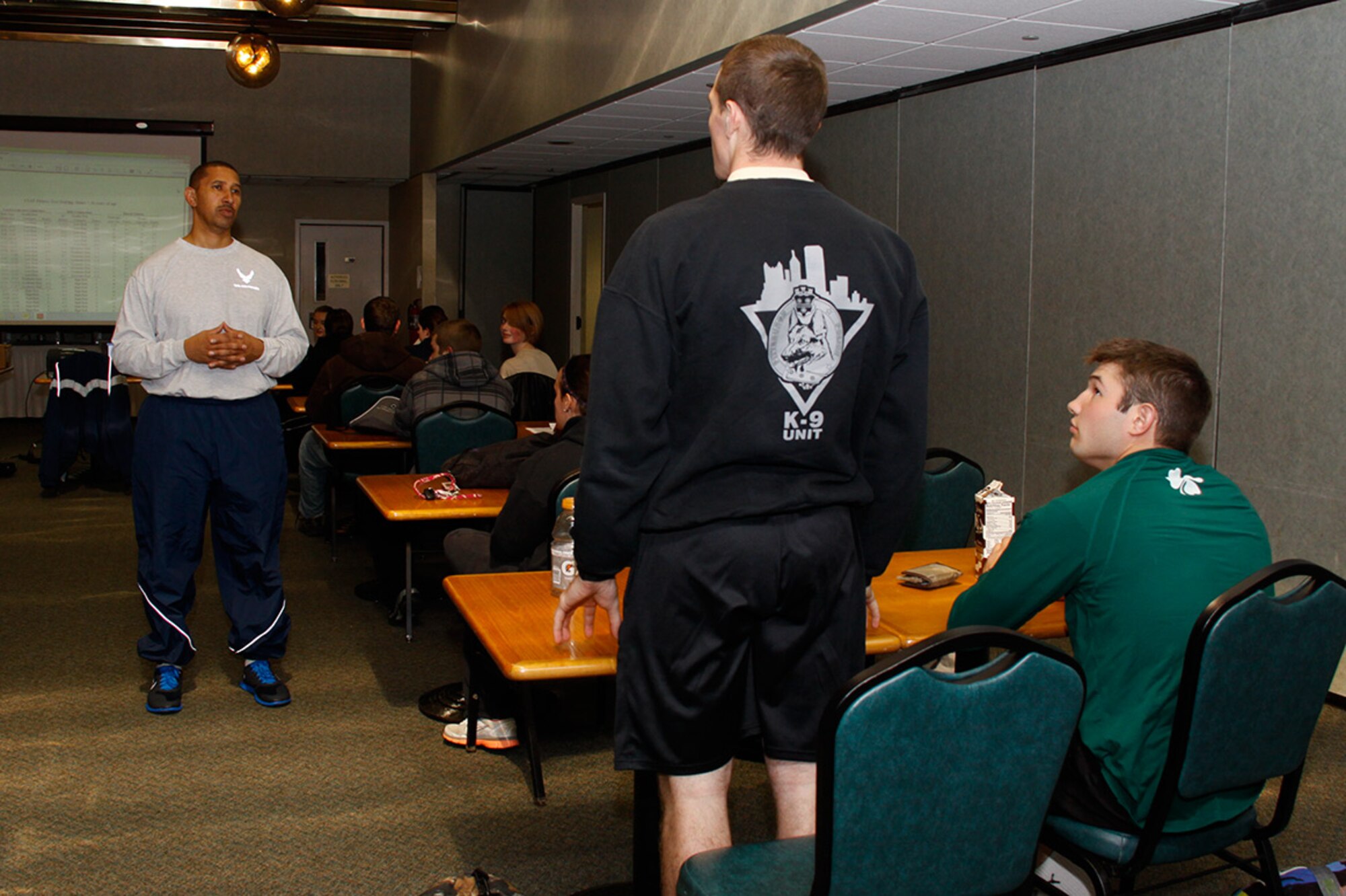 After completing a mock Physical Training test with his group, Master Sgt. Christopher Johnson, NCO in charge of the Development and Training Flight, speaks to Eric Sowinski, from Pittsburgh, Pa., about where he’ll go when he leaves for Basic Military Training, Nov. 3. 2012. Sowinski is a member of Johnson’s DTF, which trains and prepares newly assigned Airmen. The DTF serves as a bridge between when a new recruit swears in and when they leave for basic training. (U.S. Air Force photo by Senior Airman Justyne Obeldobel/Released)
