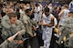 University of Connecticut players sign autographs for service members after the game against Michigan State during the Armed Forces Classic basketball game at Ramstein Air Base, Germany, Nov. 10, 2012.  Connecticut overcame Michigan 66-62. (U.S. Air Force photo/Master Sgt. Wayne Clark)
