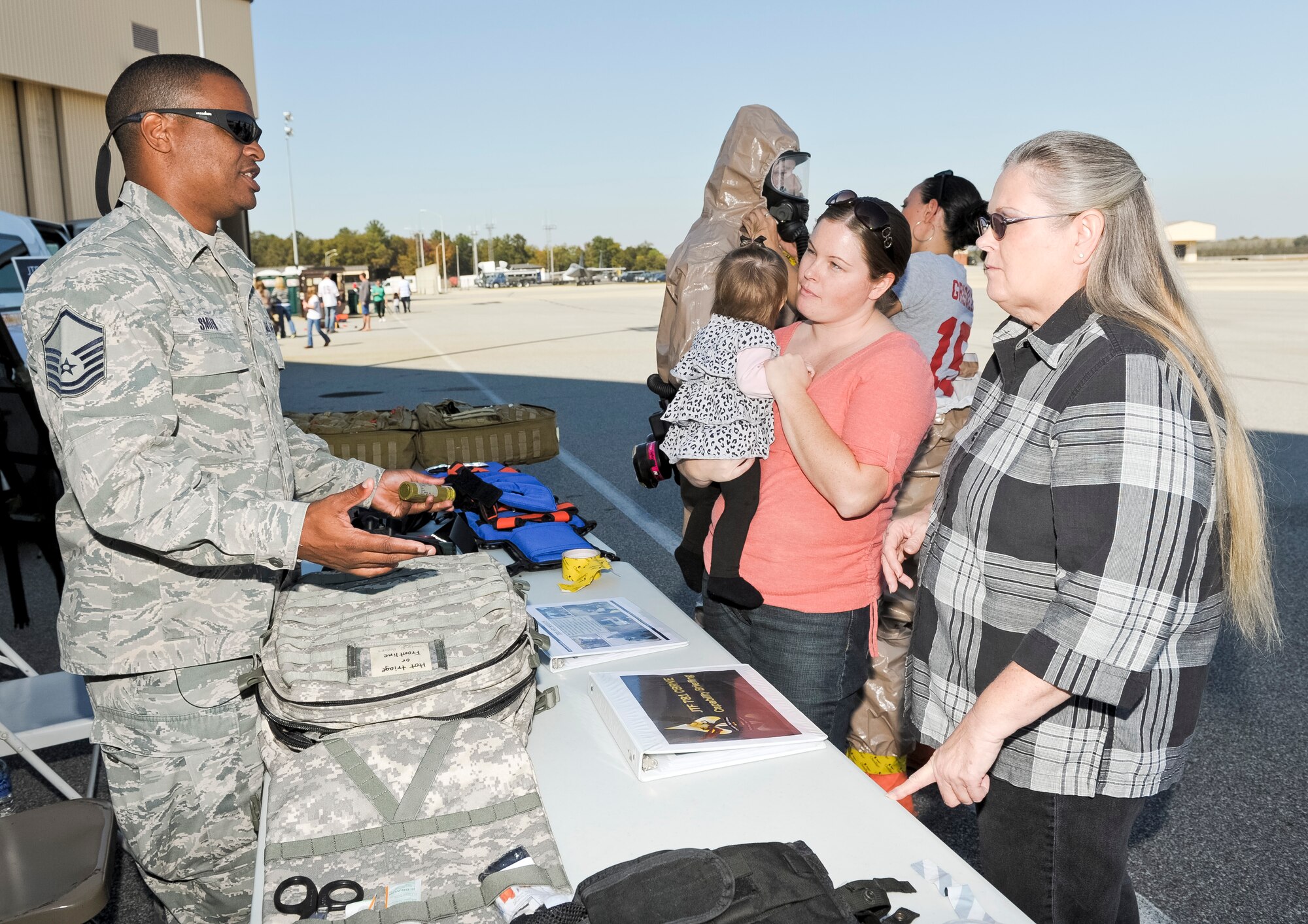 Master Sgt. Benny Smith, 116th Medical Group, 78th Joint Task Force, medical logisitic technician, explains the mission of the 78th JTF during the 116th and 461st Air Control wings annual Family Day celebration at Robins Air Force Base, Ga., Nov. 3, 2012. Family Day gave the 78th JTF personnel an opportunity to bring awareness to their mission to respond to domestic incidents as directed by the Governor.  (National Guard photo by Master Sgt. Roger Parsons/Released)