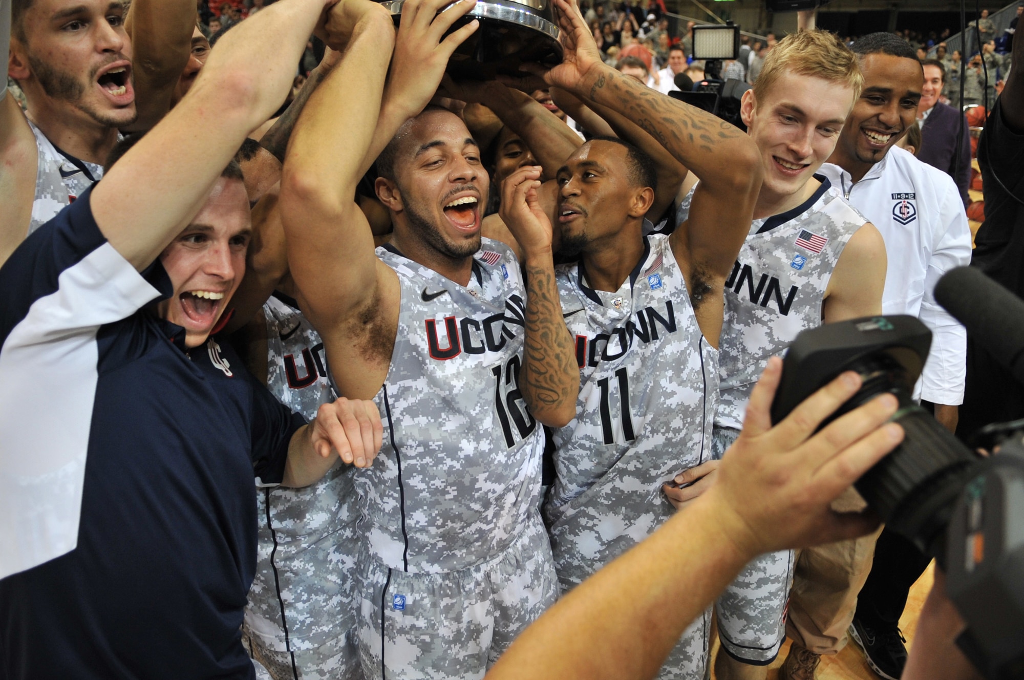 University of Connecticut players celebrate their victory over Michigan State during the Armed Forces Classic basketball at Ramstein Air Base, Germany, Nov. 10, 2012. Connecticut overcame Michigan 66-62. (U.S. Air Force photo/Master Sgt. Wayne Clark)