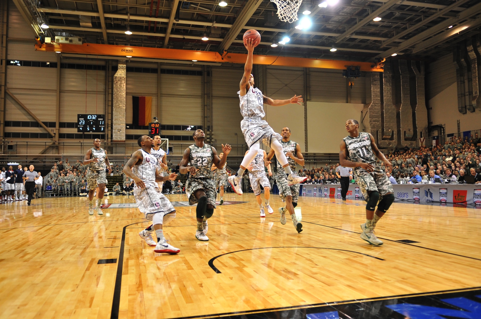 University of Connecticut guard Shabazz Napier goes up for a layup against Michigan State players during the Armed Forces Classic basketball game at Ramstein Air Base, Germany, Nov. 10, 2012.  Connecticut overcame Michigan 66-62. (U.S. Air Force photo/Master Sgt. Wayne Clark)