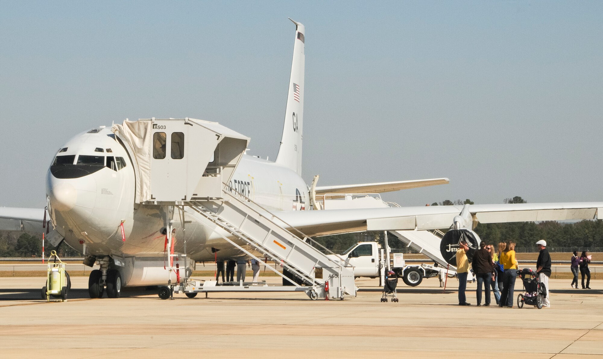 Families from Team Joint STARS tour the E-8C Joint STARS aircraft during the 116th and 461st Air Control wings annual Family Day celebration at Robins Air Force Base, Ga., Nov. 3, 2012. This marked the 10th annual Family Day for JSTARS.  The yearly event provides an opportunity to thank families for their support. (National Guard photo by Tech. Sgt. Timothy Neville/Released)