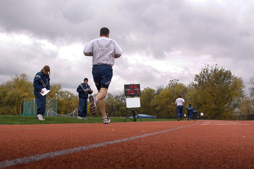 911th Airlift Wing personnel complete their 1.5 mile run during their Physical Training test held Nov. 3, 2012 at the Robert Morris University, Neville Island Sports Center in Coraopolis, Pa. Through a joint partnership with RMU and the Moon Twp. High School, unit members are authorized to use these facilities to meet their semi/annual physical fitness requirements.  The Air Force physical fitness test is comprised of a waist measurement, timed push-ups and sit-ups and concludes with a timed 1.5 mile run. Find out more about leading a healthy lifestyle by checking out the Wingman toolkit @ http://afrc.wingmantoolkit.org/  (U.S. Air Force photo by Senior Airman Justyne Obeldobel/Released)