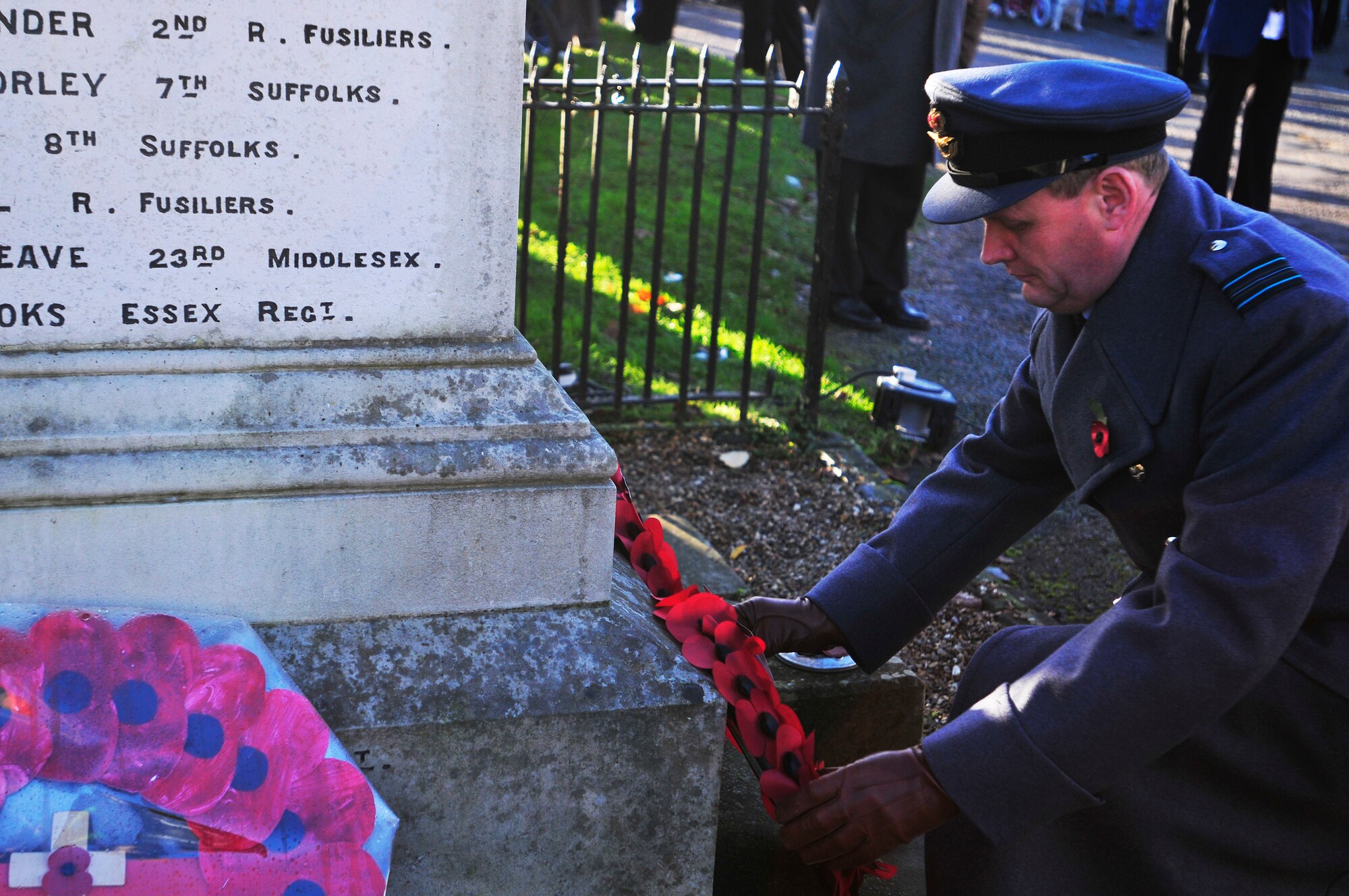 LAKENHEATH, England - Royal Air Force Sqd. Ldr. Jeremy Neild, RAF Lakenheath commander, lays a poppy wreath on the Lakenheath War Memorial during a Remembrance Day ceremony Nov. 11, 2012. Members of the 48th Fighter Wing and local community came together to pay their respects to those who made the ultimate sacrifice. (U.S. Air Force photo by Senior Airman Tiffany M. Grigg) 