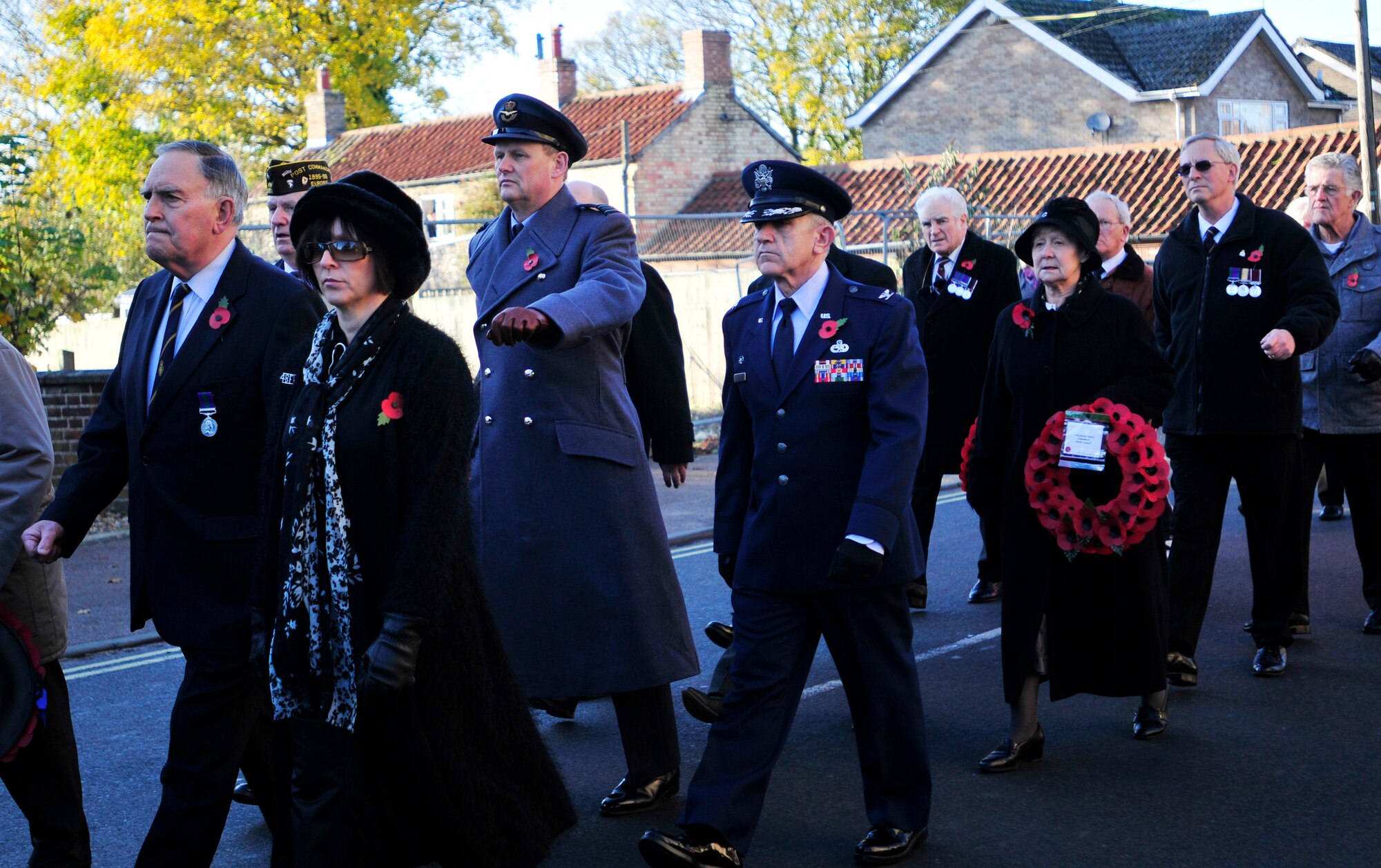 LAKENHEATH, England - Royal Air Force Sqd. Ldr. Jeremy Neild, RAF Lakenheath commander, (center left) and U.S. Air Force Col. Matthew Cox, 48th Maintenance Group commander (center right), march in a parade during a Remembrance Day ceremony in Lakenheath village Nov. 11, 2012. Members of the 48th Fighter Wing and local community came together to pay their respects to those who made the ultimate sacrifice. (U.S. Air Force photo by Senior Airman Tiffany M. Grigg) 