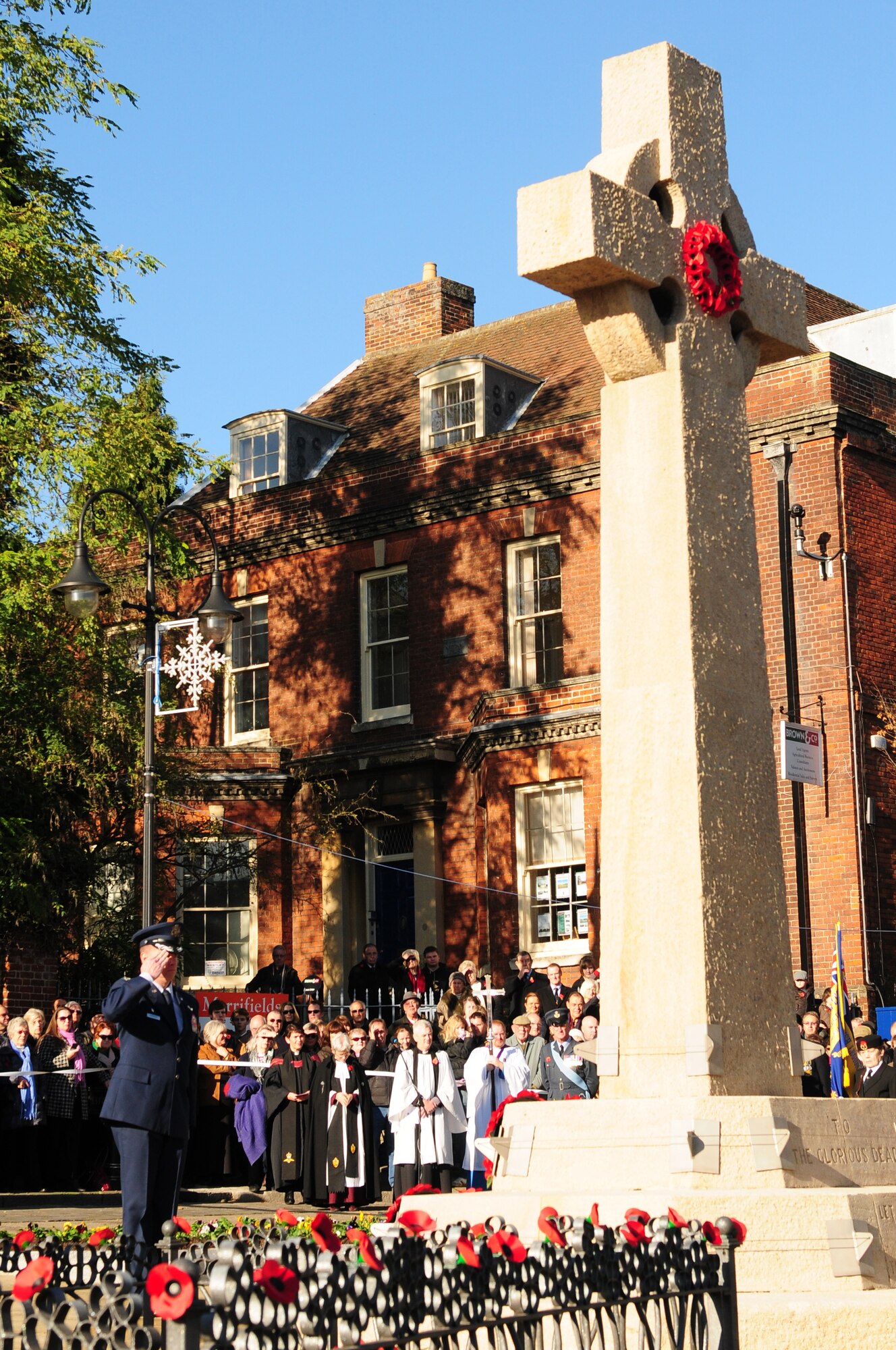 BURY ST. EDMUNDS, England -- Col. Kyle Robinson, 48th Fighter Wing commander, salutes after laying a poppy wreath during a Remembrance Day ceremony, Nov. 11, 2012. The annual ceremony is held in honor of those who have dedicated their lives in service to their country and made the ultimate sacrifice. (U.S. Air Force photo by Senior Airman Lausanne Morgan)
