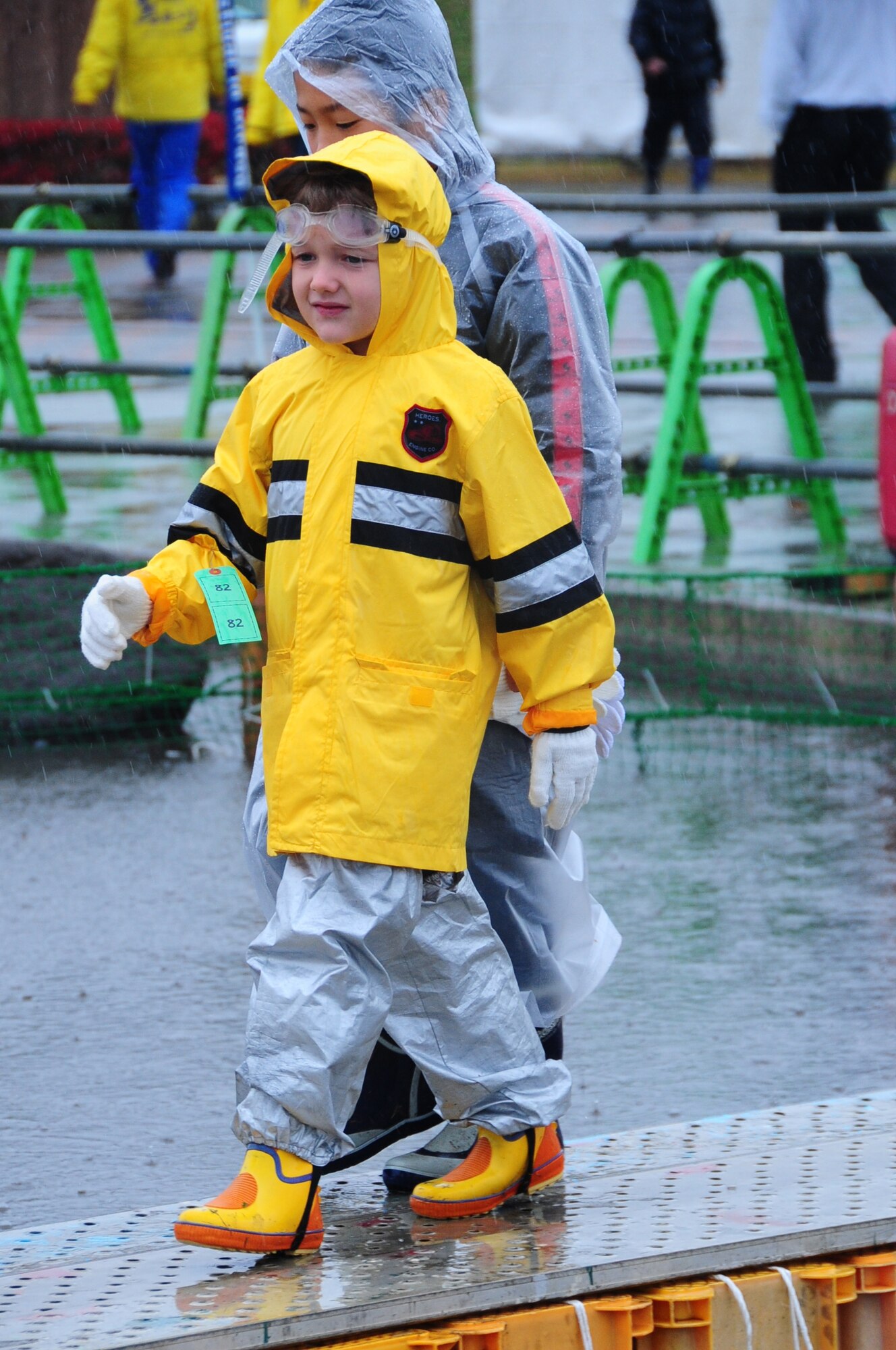 Son of Col. Matthew Dana, 35th Fighter Wing vice commander, walks across the metal boardwalk at Salmon Park, Oirase, Japan, during the start of the annual Oirase Salmon Catching Festival, Nov. 10, 2012. The festival brought together members from the base and local Japanese community and is where baby salmon are also released into the wild during the spring. (U.S. Air Force photo/ Staff Sgt. April Quintanilla)