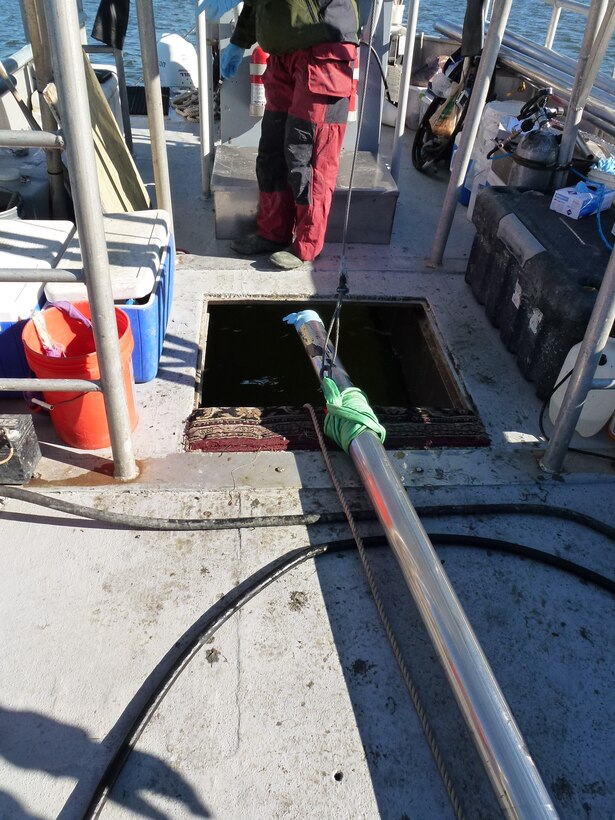 Core barrel laying out. The team initially places a glove over the tube end to keep out contamination and keep the sample in. the sampling tube is decontaminated in between each core sample.