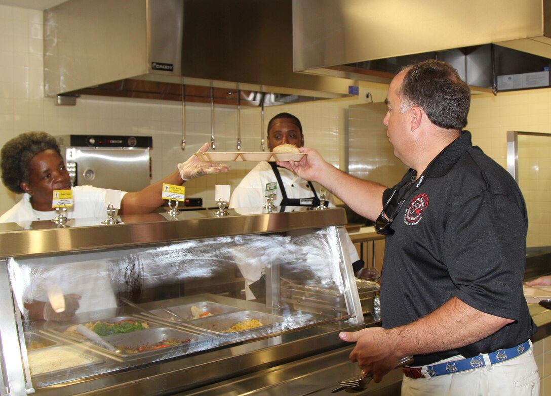 Construction Chief David Dodds samples his food at the Quad DFAC test meal.