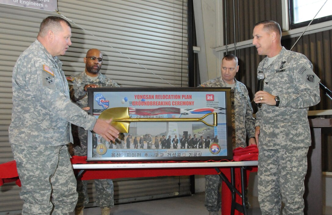 Far East District commander Col. Donald E. Degidio, Jr., right, presents U.S. Forces Korea commander Gen. James D. Thurman, left, with a plaque celebrating his part in groundbreaking ceremony.  Thurman visited the Far East District compound in Seoul's Dongdaemun district Nov. 13, addressing the U.S. Army Corps of Engineers' U.S. and Republic of Korea staff members.  