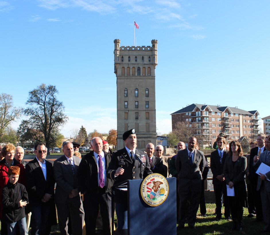 Deputy Commander Lt. Col. Jim Schreiner speaks at a State of Illinois and Office of Governor Pat Quinn (to the left of Schreiner) event highlighting dam removal along several Illinois rivers at the Hofmann Dam removal site, Riverside, Ill., Oct. 26, 2012. The purpose of dam removal is to improve water quality and fish habitat and to restore riverine characteristics. "This project is a great feat," Lt. Col. Schreiner said. "We already have 10 new species of fish that have moved up the river. Through partnership, we put a high importance on understanding the needs of the community."
