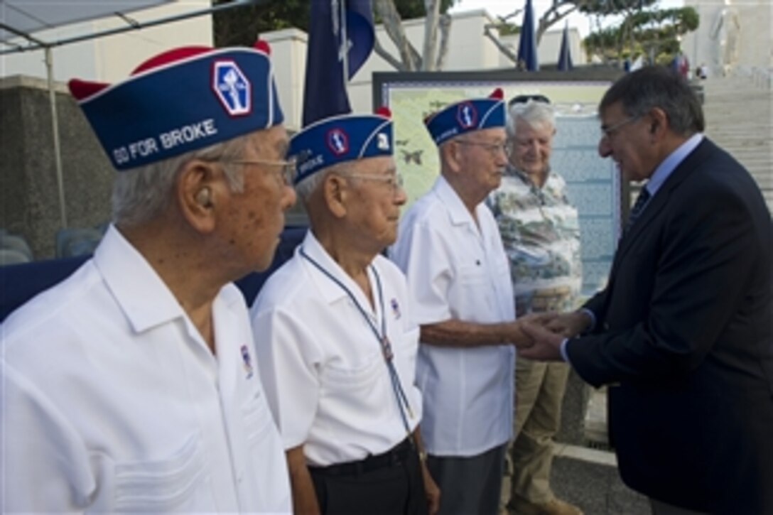 Secretary of Defense Leon E. Panetta shakes hands with World War II veterans after laying a wreath at the National Memorial Cemetery of the Pacific in Honolulu, Hawaii, on Nov. 11, 2012.  Panetta stopped in Hawaii for the Veterans Day ceremonies before continuing on a six-day trip to Australia and Asia.  
