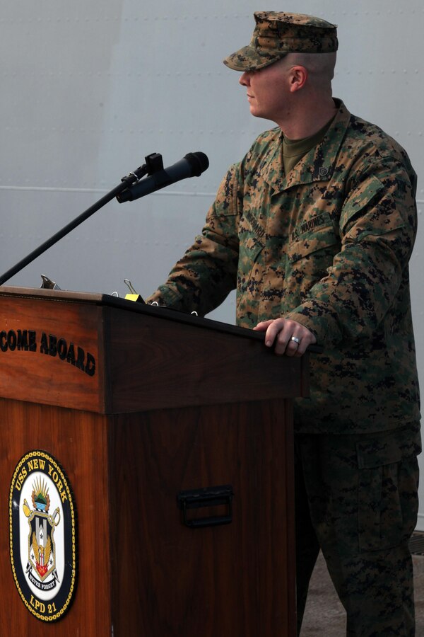 Staff Sgt. Christopher S. Woodard, a platoon sergeant with Alpha Company, Battalion Landing Team 1st Battalion, 2nd Marine Regiment, 24th Marine Expeditionary Unit, reads the birthday message on the flight deck of the USS New York during a cake-cutting ceremony to celebrate the Marine Corpsâ€™ 237th birthday, Nov. 10, 2012. This was the first of perhaps many more Marine Corps birthday celebrations aboard the New York, built with seven-and-a-half tons of steel from the World Trade Center, as she sails on her maiden deployment. The 24th MEU is deployed with the Iwo Jima Amphibious Ready Group and is currently in the 6th Fleet Area of Responsibility as a disaster relief and crisis response force. Since deploying in March, they have supported a variety of missions in the U.S. Central and European Commands, assisted the Navy in safeguarding sea lanes, and conducted various bilateral and unilateral training events in several countries in the Middle East and Africa. The 24th MEU is scheduled to return to their home bases in North Carolina later this year. (U.S. Marine Corps photo by Staff Sgt. Robert Fisher III/Released)