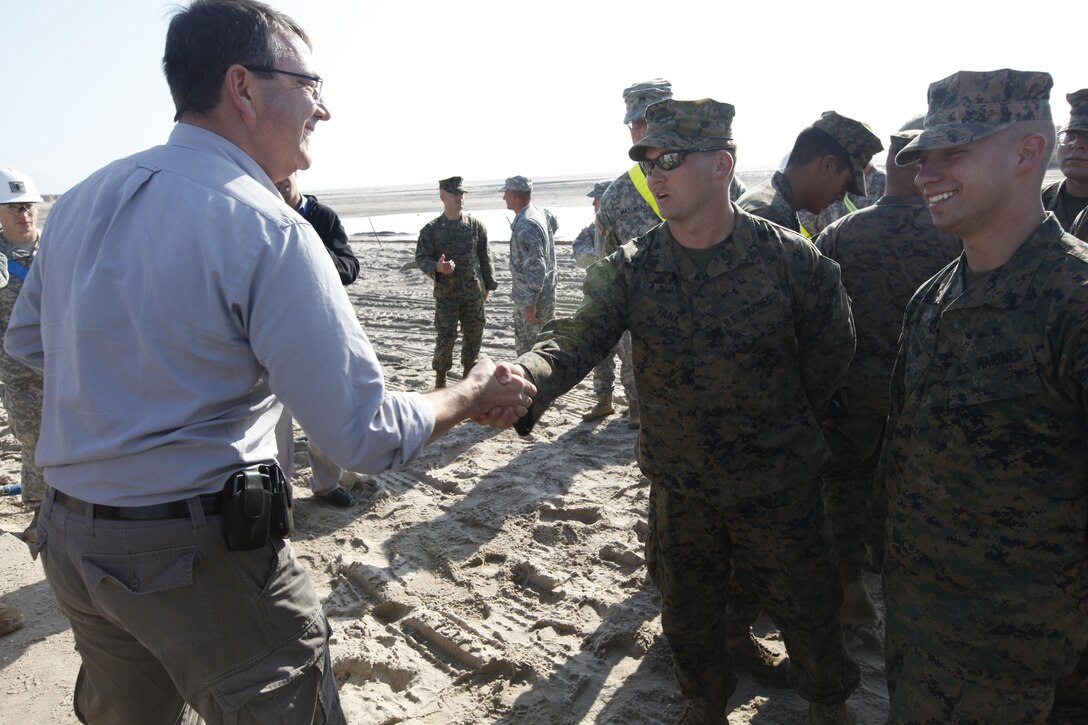 Ashton Carter, the United States Deputy Secretary of Defense, shakes hands with Marines from 8th Engineer Support Battalion, 2nd Marine Logistics Group who have been conducting humanitarian efforts in New York after Hurricane Sandy in Breezy Point, N.Y., Nov. 12. Carter vsited the Marines and other service members to congratulate them on their hard work and to oversee the progress of the area so far. 