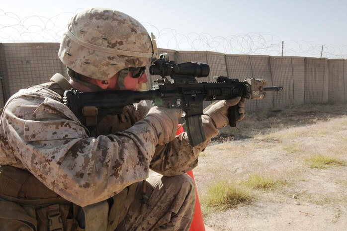 Cpl. Eric Bobst, an Infantry Automatic Rifleman with personal security detachment, 2nd Battalion, 7th Marines, Regimental Combat Team 7, fires his IAR at a close-quarters range at Forward Operating Base Sabit Qadam, Oct. 22. The IAR is replacing the M249 Light Machine Gun as the automatic weapon organic to the infantry squad.