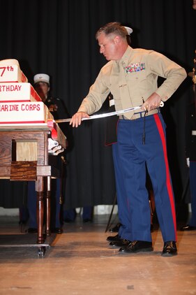 Col. Philip J. Zimmerman, the commanding officer of MCAS Cherry Point, cuts the first peice of cake during the cake cutting ceremony of the Cherry Point 237th Marine Corps Ball Ceremony at the station theater Nov. 8.