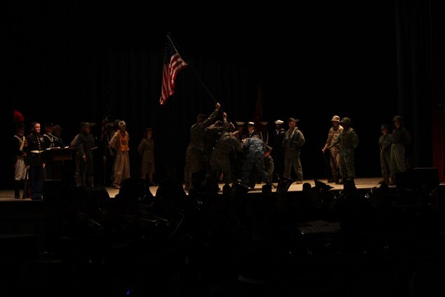 Five Marines and one Sailor recreates the flag raising of Iwo Jima before the cake cutting ceremony of the Cherry Point 237th Marine Corps Ball Ceremony at the station theater Nov. 8.