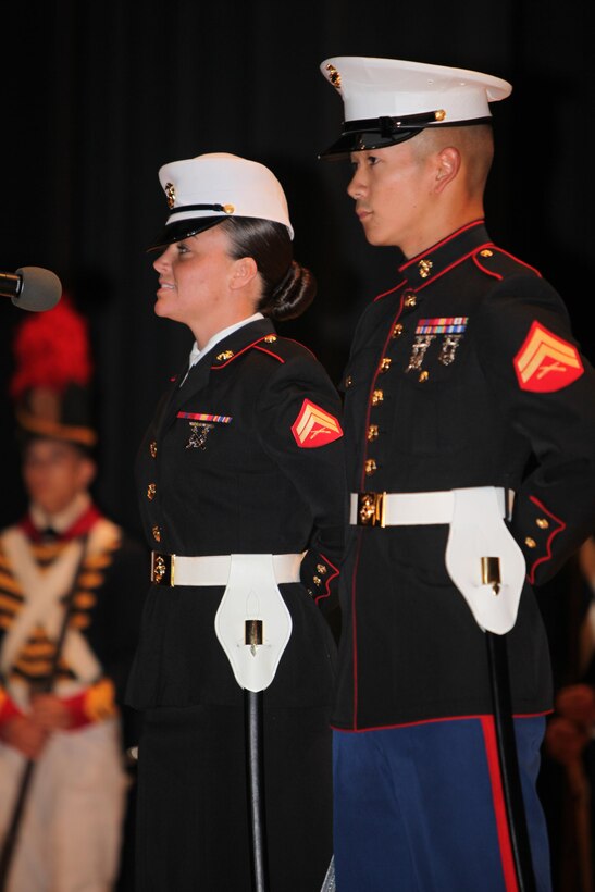 Corporals Mary Boyd, left, and Jayson Yanamura, right, speak about the Marine Corps heritage from throughout history during th the Cherry Point 237th Marine Corps Ball Ceremony at the station theater Nov. 8.