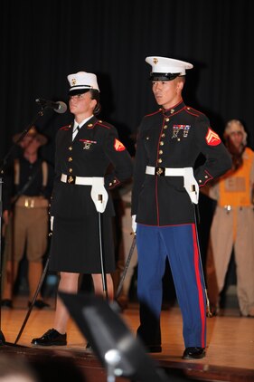 Corporals Mary Boyd, left, and Jayson Yanamura, right, speak about the Marine Corps heritage from throughout history during th the Cherry Point 237th Marine Corps Ball Ceremony at the station theater Nov. 8.