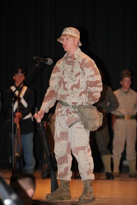Cpl. Scott Tomaszycki, dressed as a Southwest Asia Marine, speaks about the war era he represents during the Cherry Point 237th Marine Corps Ball Ceremony at the station theater Nov. 8.