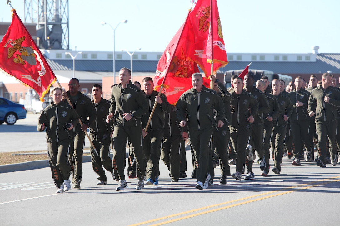 Maj. Gen. Glenn M. Walters, right, leads a large pack of 2nd Marine Aircraft Wing runners during the 2nd MAW Marine Corps Birthday Run, Nov. 9. More than 1,000 Marines ran in the birthday run. Brig. Gen. Gary L. Thomas, center, and Sgt. Maj. Lisa Nilsson, right, ran with Walters and will be going forward as the commanding general and sergeant major of 2nd MAW fwd. Walters is the commmanding general for 2nd MAW.