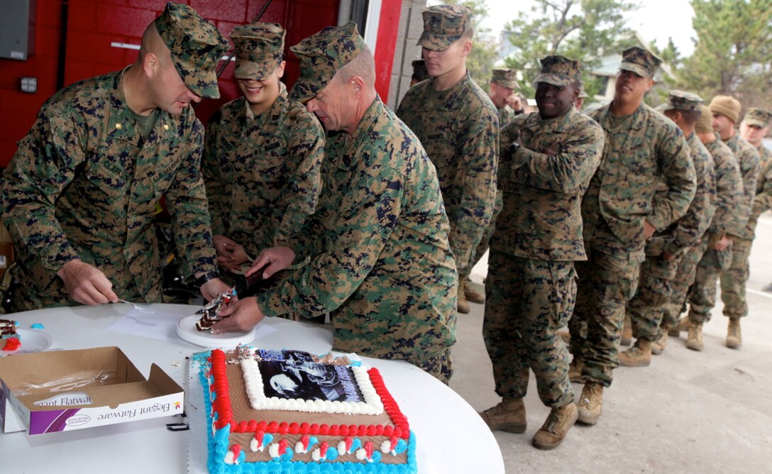 The Marines of 8th Engineer Support Battalion, operating in Breezy Point, a small coastal community of New York City, took a brief pause, Nov. 10, to celebrate the Marine Corps 237th birthday with members of the Breezy Point community. The Marines of the 8th Engineer Support Battalion, 2nd Marine Logistics Group, II Marine Expeditionary Force are working in New York with the Federal Emergency Management Agency, the U.S. Army Corps of Engineers and the National Guard in order to clear debris from walkways and public spaces in order to help the residents of New York City return to normalcy as soon as possible.