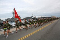 NORFOLK (Nov. 8, 2012) - Col. Susan Seaman, commanding officer, Headquarters and Service Battalion, Marine Forces Command and Sgt. Maj. Scott Helms, lead a formation run along the peir of Naval Station Norfolk to commemorate the 237th Marine Corps Birthday.