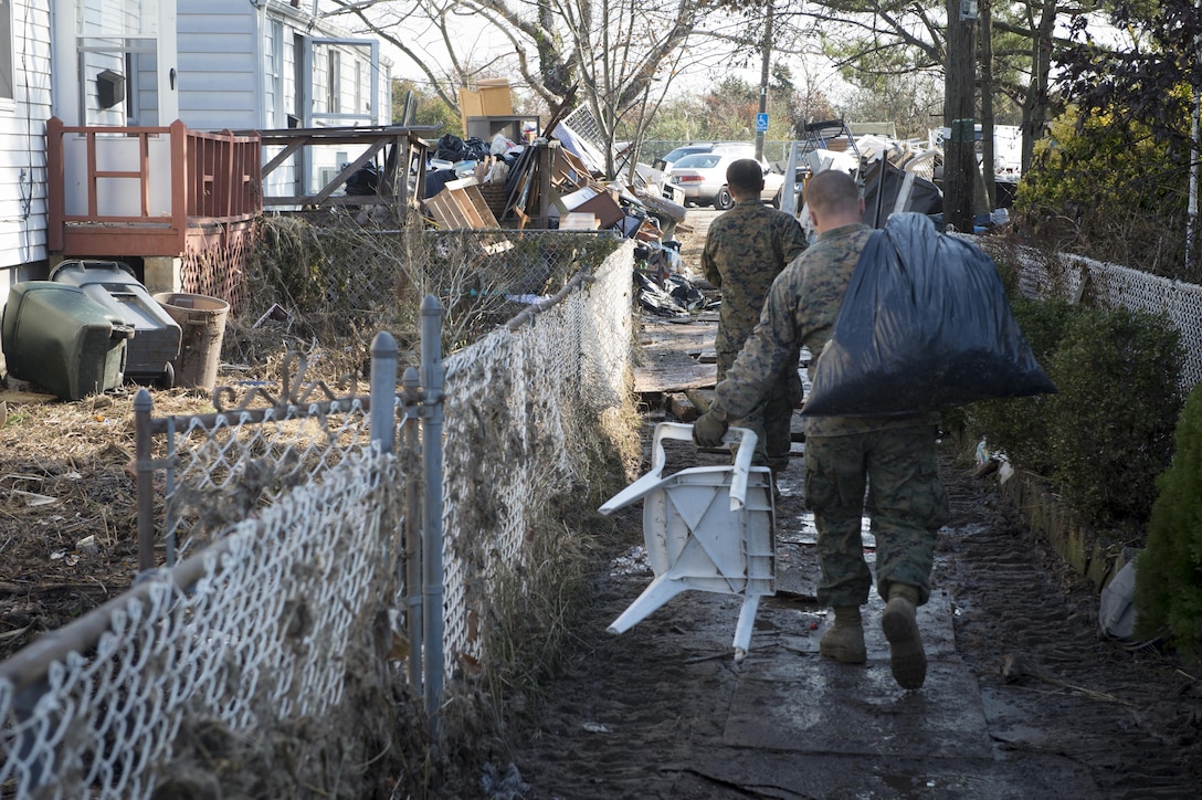 NEW YORK (Nov. 11, 2012) - Marines from the 8th Engineering Support Battalion (8th ESB) from Camp Lejeune, N.C. spent Veteran’s Day weekend continuing relief efforts for New York residents impacted by Hurricane Sandy.  Hurricane Sandy was the largest Atlantic hurricane on record and caused the most damage in New York and New Jersey Oct. 29, 2012.  (U.S. Navy photo by Chief Mass Communication Specilalist Ryan J. Courtade/Released)